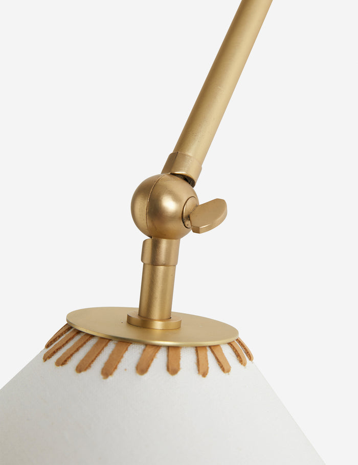 #color::brass | Close up of the Arroyo Mixed-Material Adjustable Arm Sconce by Elan Byrd.