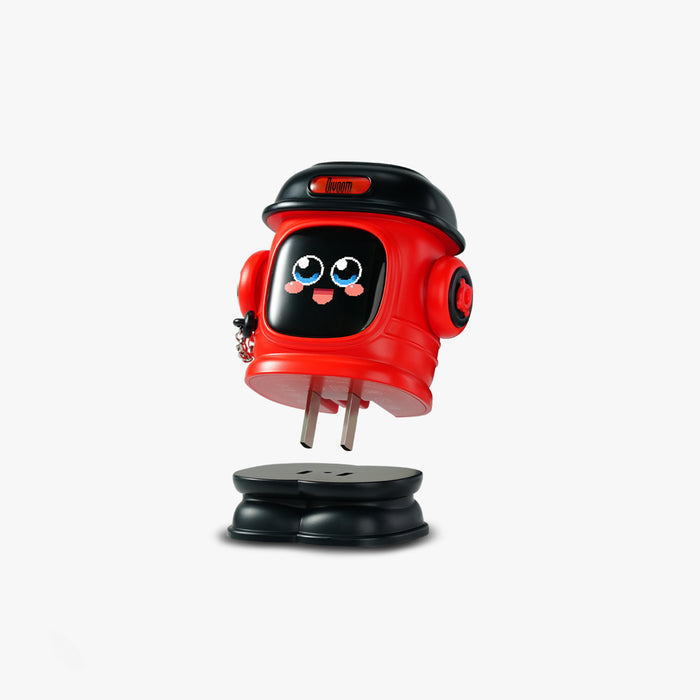 Divoom Dipow-65W Multi-socket Fast Charger, red character-style charger with a smiling face screen, black cap top and fold-out prongs on a plain background, smartphone app controlled, desk decor