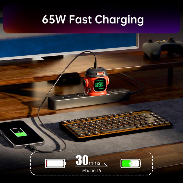 Divoom Dipow-65W Multi-socket Fast Charger, red robot-style charger on a power strip with a 65W display charging a phone beside a keyboard and monitor, smartphone app controlled, desktop workspace decor