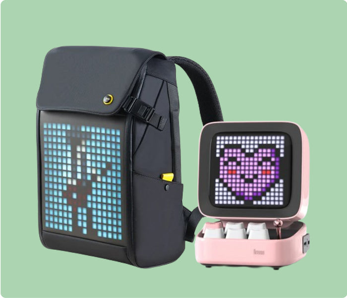 Divoom Ditoo Plus & Pixoo M Backpack, a black pixel backpack with blue music note display beside a pink pixel speaker with purple heart face, smartphone app controlled, desk and commute decor