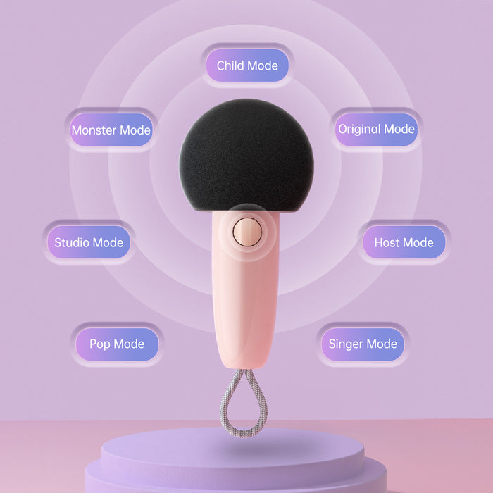 Divoom Fairy-OK Retro Mini Karaoke Speaker, a pink handheld microphone with black mesh head and labeled voice effect modes, audio playback for kids party decor