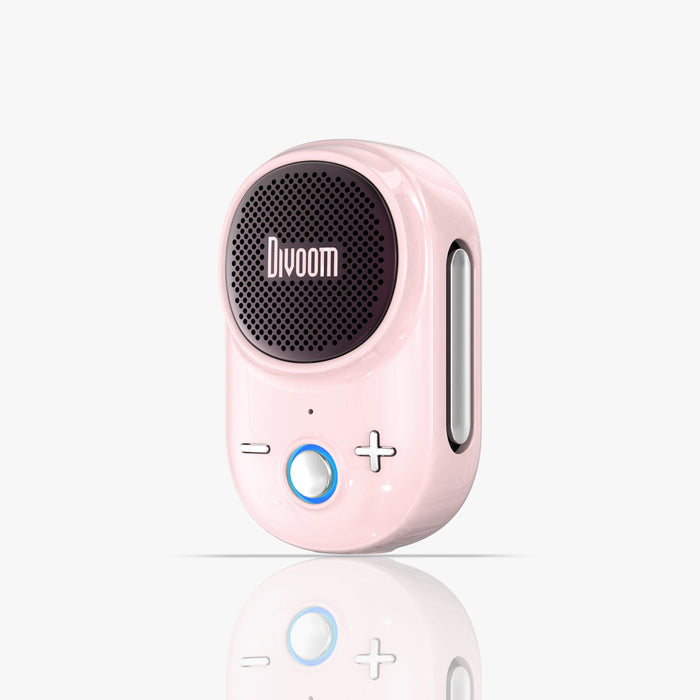 Divoom Itour-S Portable Bluetooth Speaker, glossy pastel pink speaker with black circular grille and silver side loop on a clean white background, portable audio desk decor