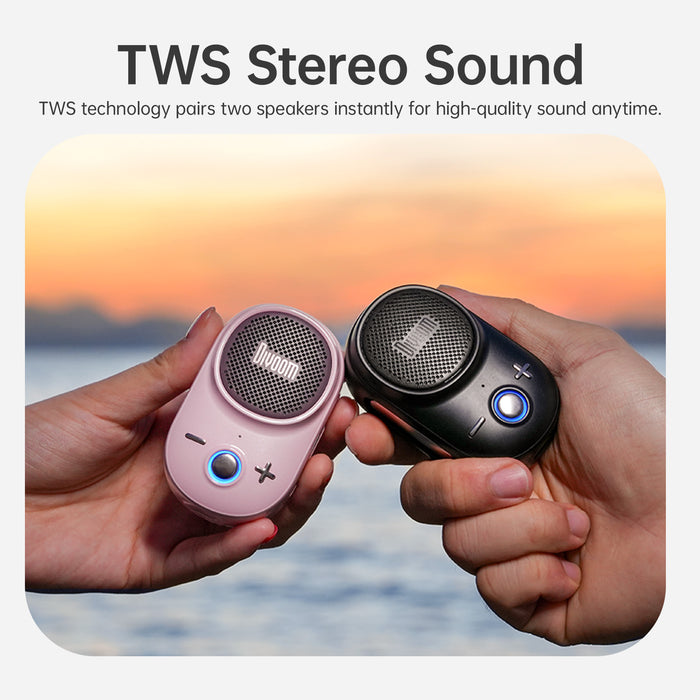 Divoom Itour-S Portable Bluetooth Speaker, pink and black paired mini speakers held in both hands with TWS stereo sound text, portable audio for beach sunset decor