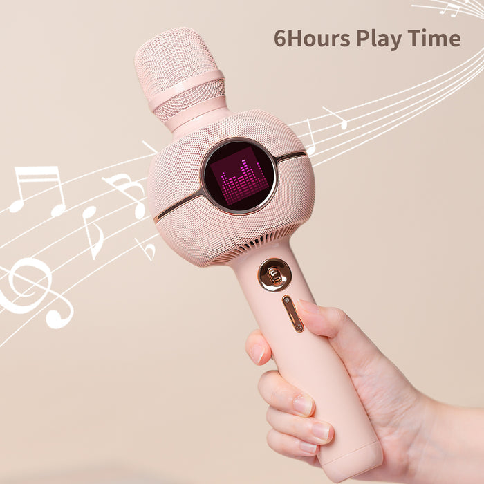 K-StarSpark, pastel pink karaoke microphone with a pixel equalizer display held in hand, 6-hour playtime audio companion, home karaoke party decor