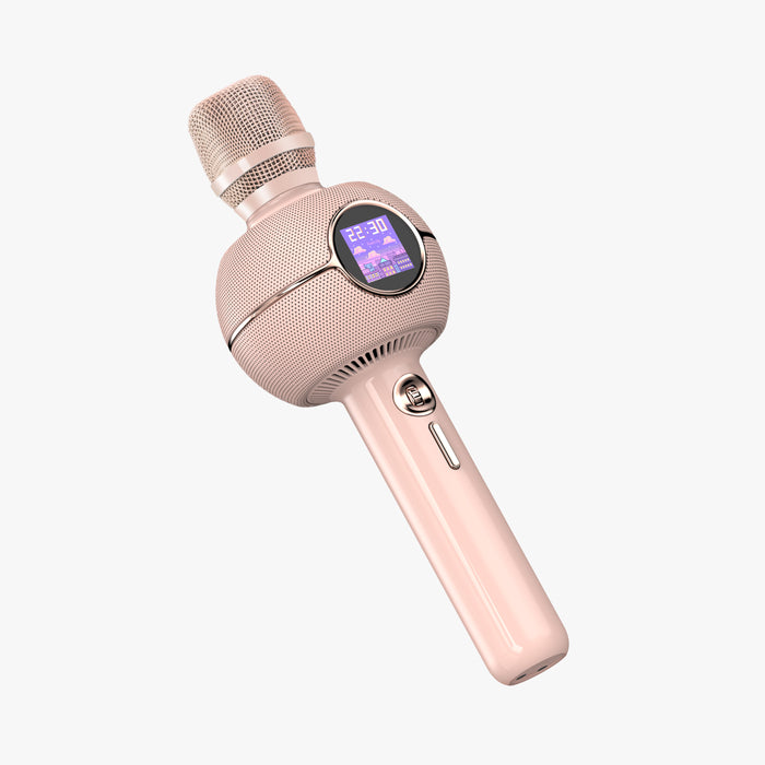 K-StarSpark, rose gold karaoke microphone with a round display showing a purple pixel city clock, audio playback and mic controls, home karaoke party decor