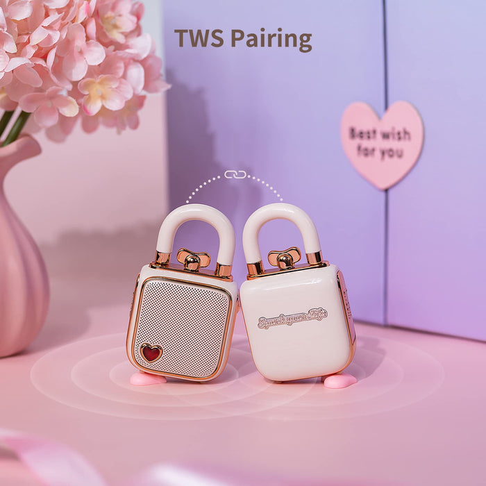Divoom Lovelock Bluetooth Speaker, two white lock-shaped speakers with gold trim paired together on a pink tabletop, TWS stereo audio, cute bedroom decor