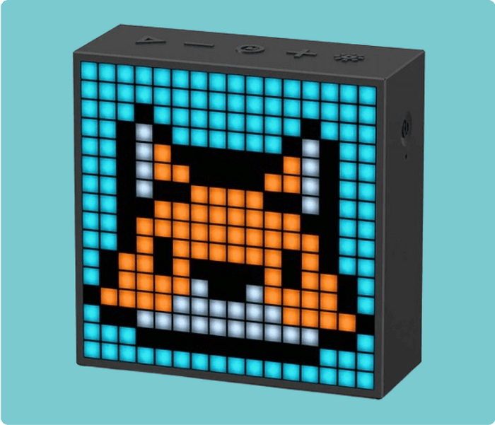 Divoom Pixoo & Pixoo-Max & Timebox-Evo, black pixel display with an orange cat face on a bright blue grid background, smartphone app controlled, desk decor