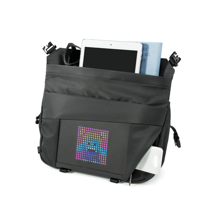 Divoom Sling Bag-V Pixel Art LED Sling Bag, a black sling bag with colorful pixel face display, tablet and accessories inside, smartphone app controlled, daily commute decor