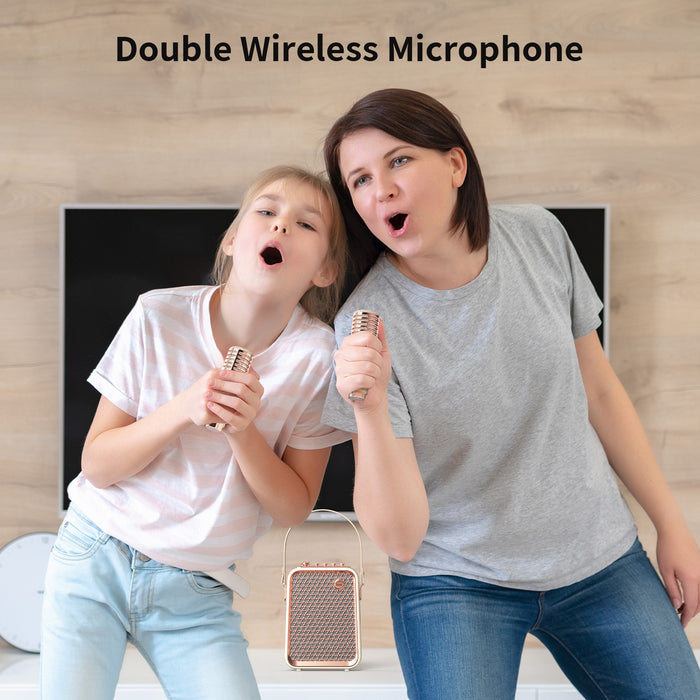Divoom Songbird-HQ Portable Karaoke Bluetooth Speaker | Home KTV sound set, woman and child singing with two gold wireless microphones beside the matching speaker, Bluetooth audio, family living room karaoke decor