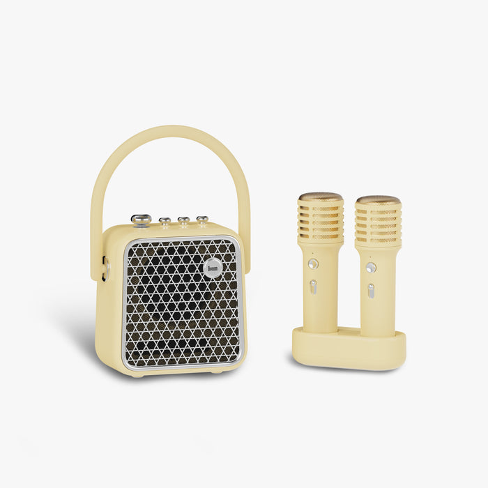 Divoom SongBird-SE Portable Bluetooth Speaker, cream speaker with arched handle and silver grille beside two matching wireless microphones on a plain white background, audio for karaoke room decor