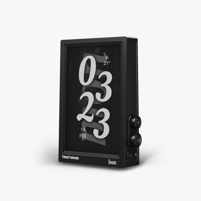 Times Frame Pure, black digital display with oversized white clock numerals, weather icon and date on screen, smartphone app controlled, minimalist desk decor