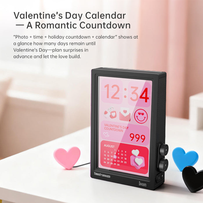 Times Frame Pure, black digital frame with a pink Valentine’s Day countdown screen, clock, calendar and heart icons, smartphone app controlled, romantic bedroom decor
