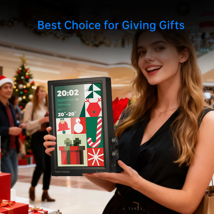 Times Frame Pure, held by a smiling woman with a festive holiday pixel display of gifts, snowman and stocking, smartphone app controlled, Christmas gift decor