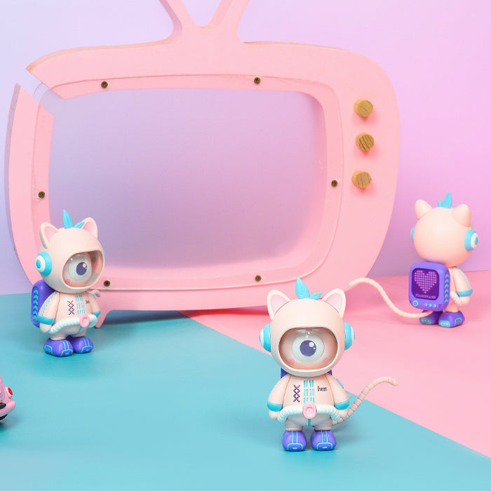 Divooo-The Divoom Mascot, three pastel robot cat figures with one large eye posed around a pink retro TV set, smartphone app controlled, playful desk decor