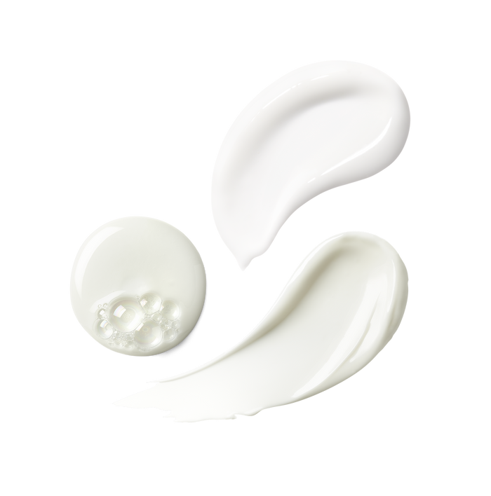 Close-up of three white skincare product textures shown as swatches.
