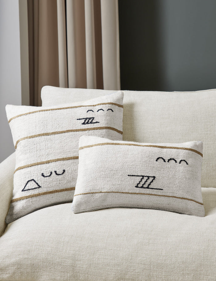 #style::lumbar #style::square | The Iconic ivory stripe square pillow and lumbar pillow sit together on a natural linen sofa