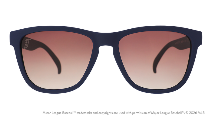 Front view of sunglasses. Blue front frame. Brown gradient lenses. Jumbo Shrimp logo etching in top corner of lens.