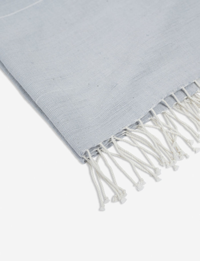 #color::light-gray | Close-up of the fringed ends on the Melkam light gray Hand Towel by Bolé Road Textiles