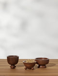 #color::acacia | Set of three mini footed walnut bowls by Sarah Sherman Samuel