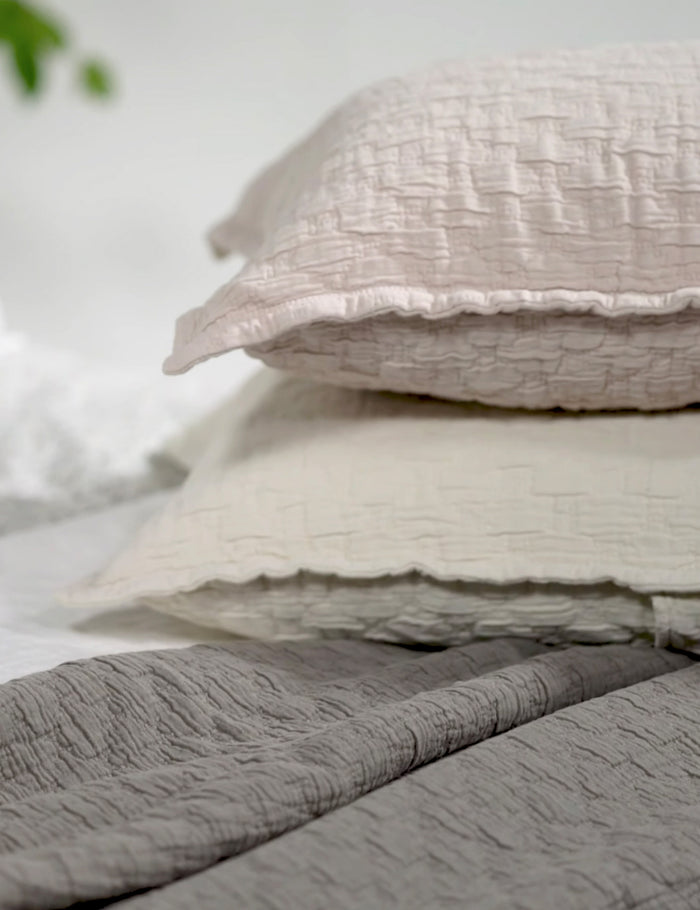 #color::pebble #color::blush #color::greige #color::white #size::euro | The Ojai Cotton Matelasse Euro Sham by Pom Pom at Home in all its colors are stacked atop each other