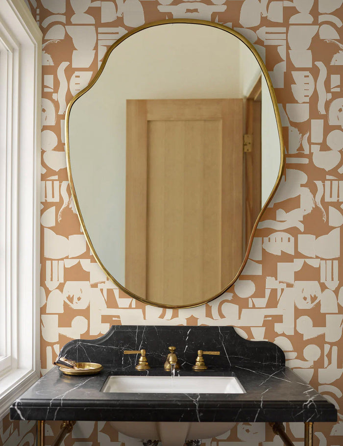 #color::tan-+-ivory | Tan and ivory Organic Shapes Wallpaper by Sarah Sherman Samuel is in a bathroom with an organic shaped golden framed mirror