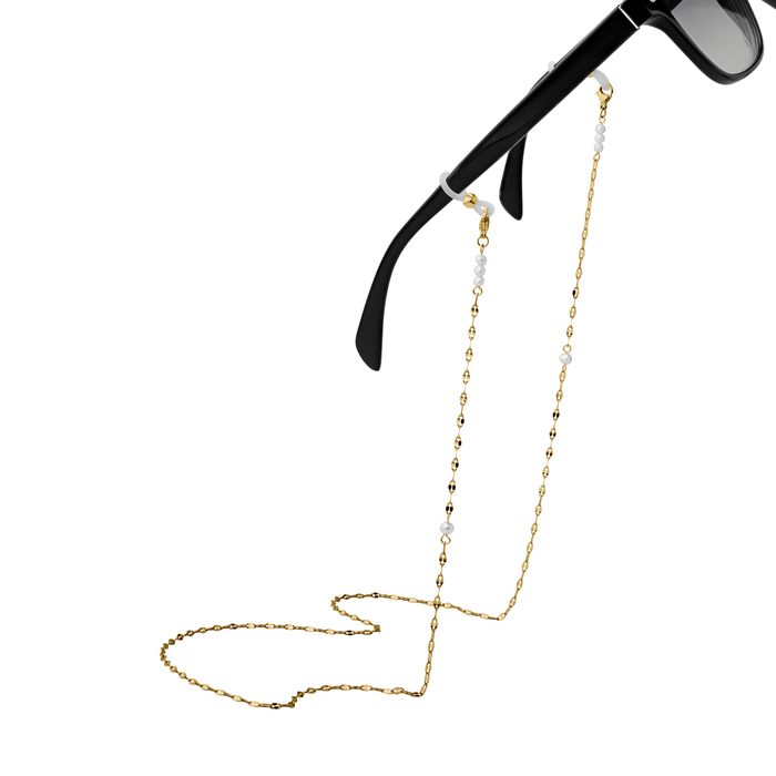 Gold eyeglass chain attached to black sunglasses on a white background