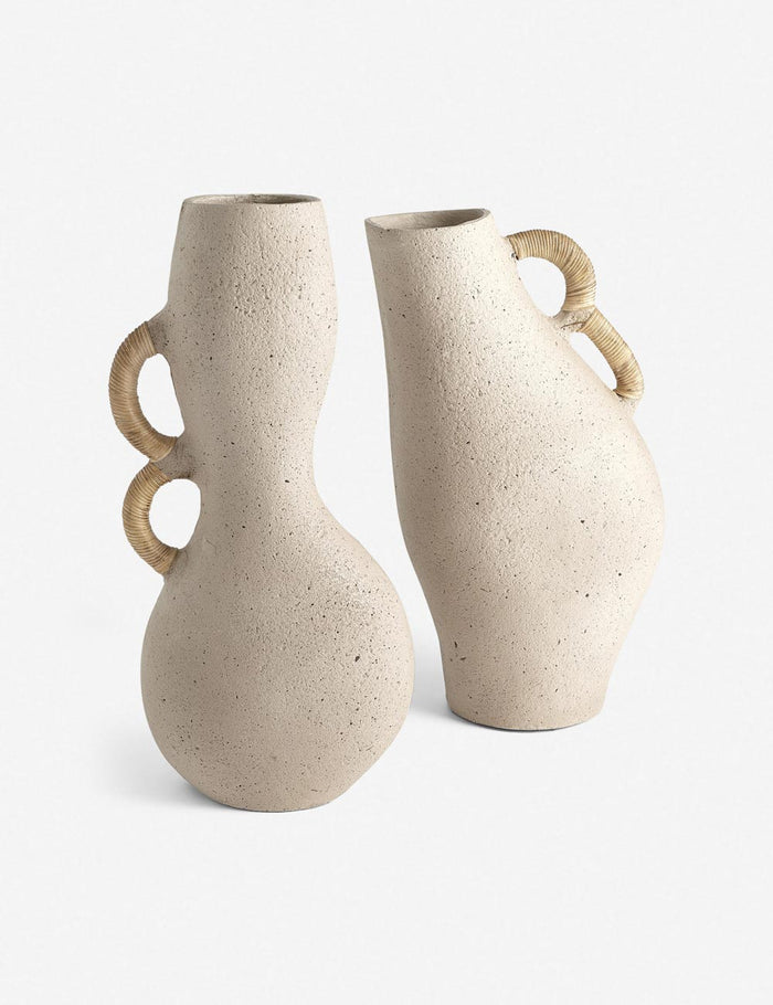 | Pisa natural toned organic vase with rattan wrapped handles stands next to another natural toned vase