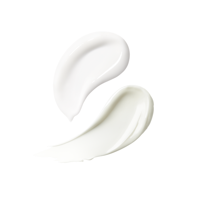 Close-up of two white skincare texture swatches.