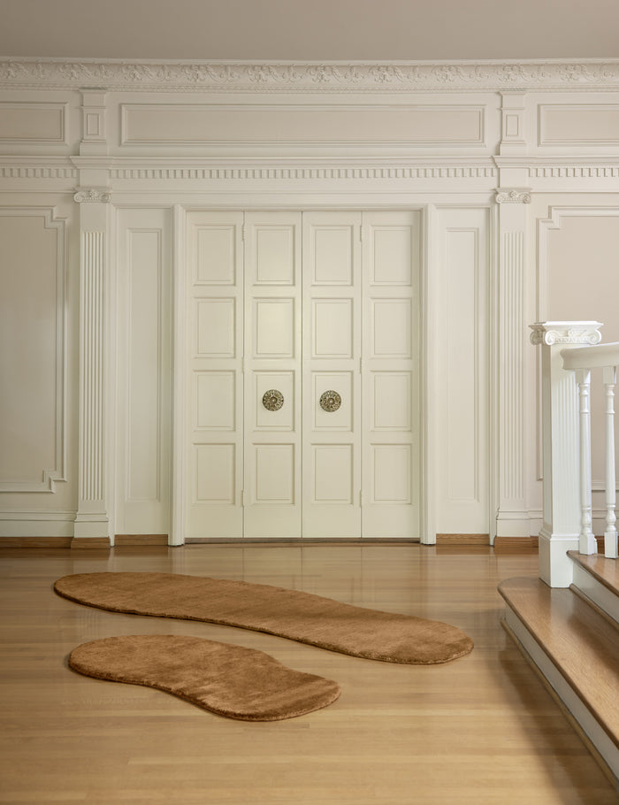 #size::2--x-4- #size::2-8--x-8- | Both sizes of the Rangely Rug lay in an open room in front of two white accented french doors