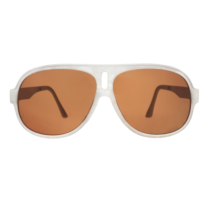 Aviator sunglasses with brown non-reflective lenses on a bright orange and pink starburst background.